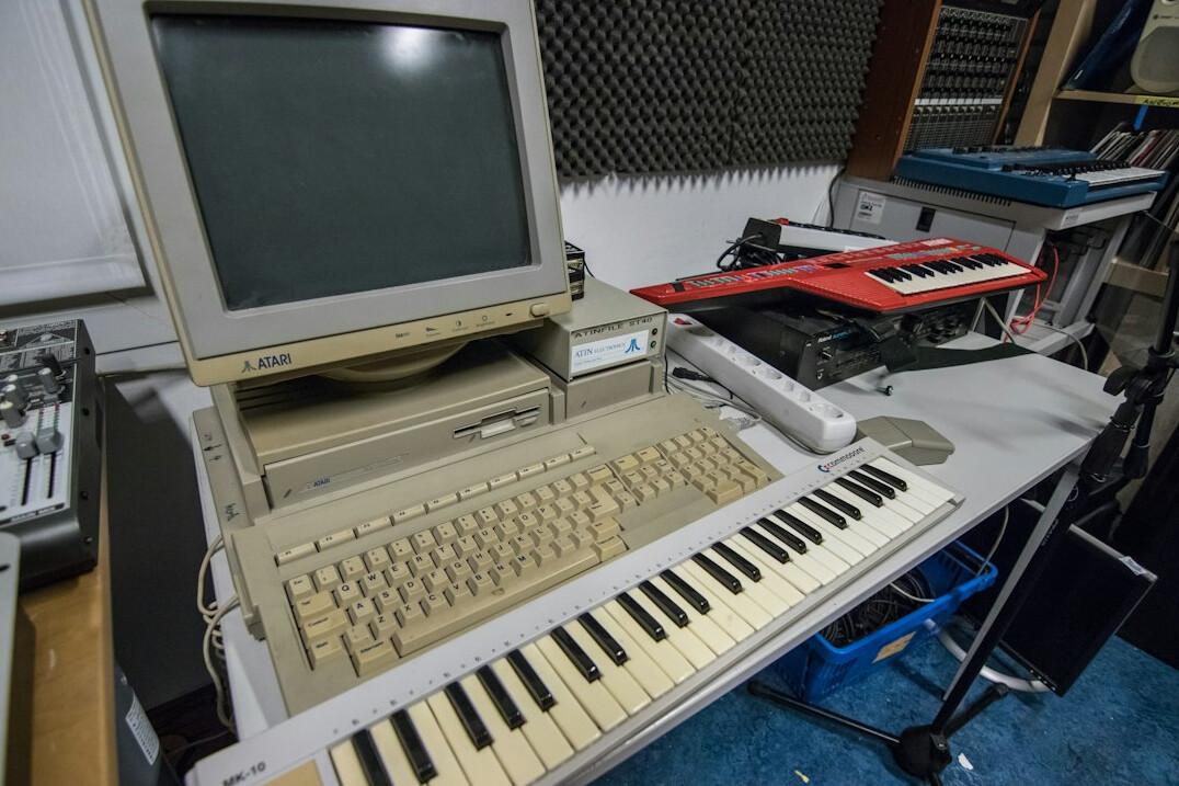 Analog video editing suite with multiple CRT monitors and a mixing console