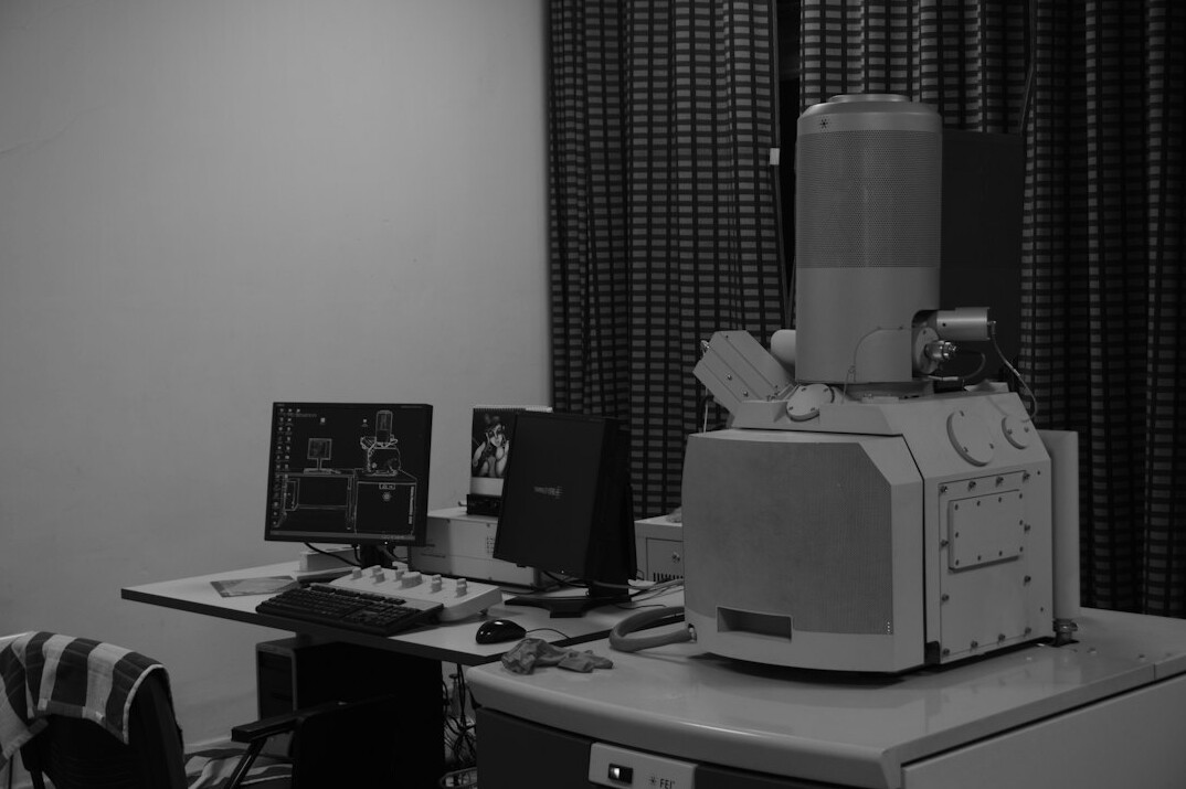 Early digital video editing workstation with a flat monitor and camera